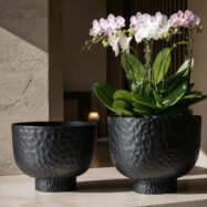 Black hammered raised bowl planters in a luxury interior