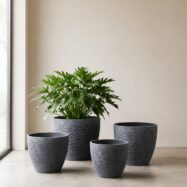 Blue gray stone textured round planters in four sizes