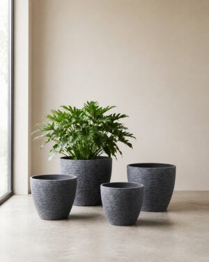 Blue gray stone textured round planters in four sizes