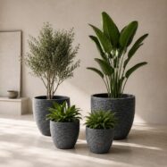 Blue gray stone textured round planters styled indoors