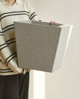 Close view of the lightweight light gray stone textured square planter